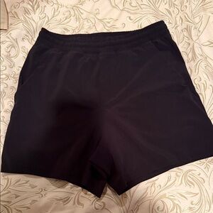 Linerless men’s black lululemon pace breaker short. Size Medium.